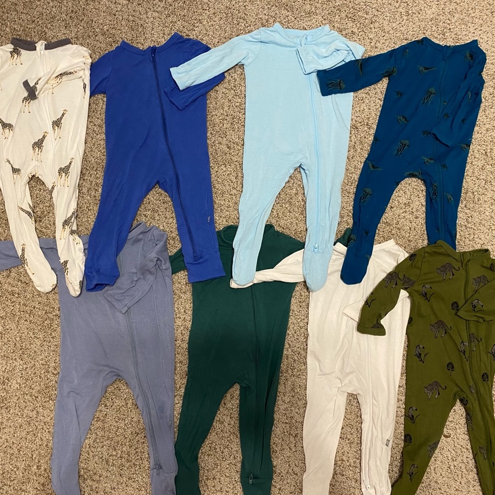 Seven Kyte baby footies and one Kyte Baby Romper. All 3-6 months